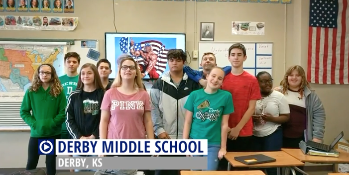 Derby Middle School takes time out to do a promotional spot for a school vendor.